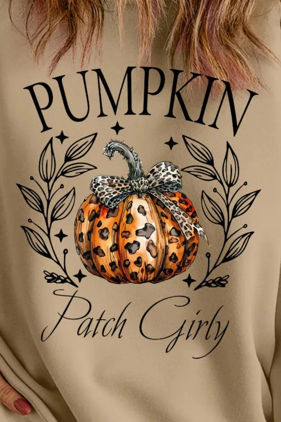 Khaki crewneck sweatshirt with a leopard print pumpkin graphic and "Pumpkin Patch Girly" text.