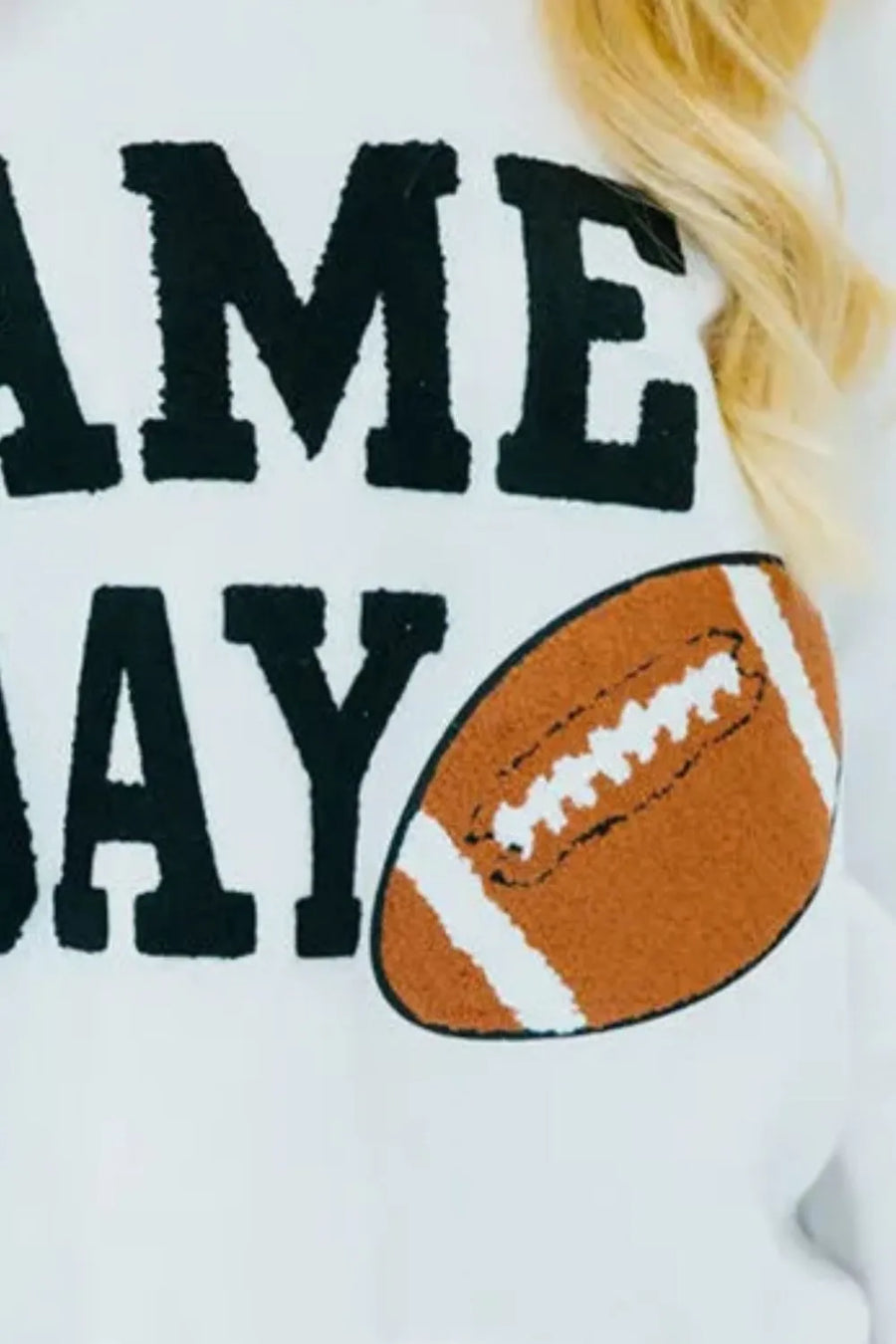 White sweatshirt with black "GAME DAY" graphic and football detail