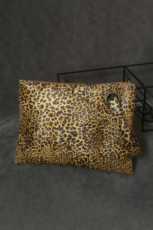 Leopard print zip-top clutch with a metal grommet detail and wrist strap.