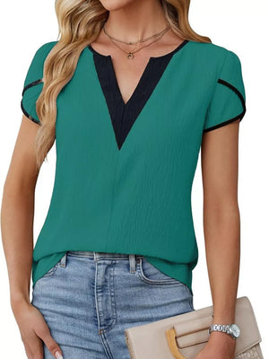 Peacock green blouse with black trim V-neck and petal sleeves.