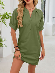 Army green cotton dress with notched V-neck, short puff sleeves, and button front.