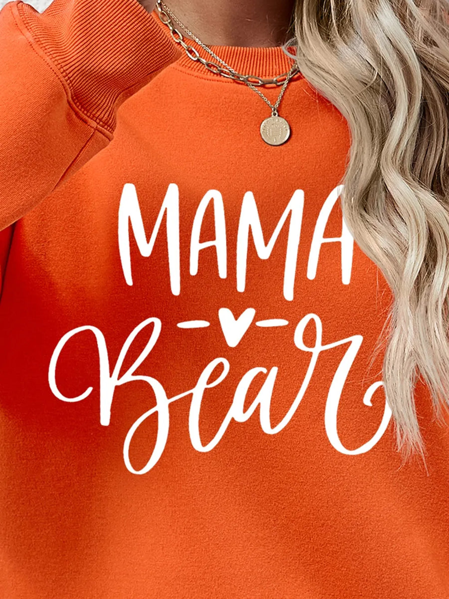 Orange Mama Bear graphic sweatshirt with white script text and heart detail.