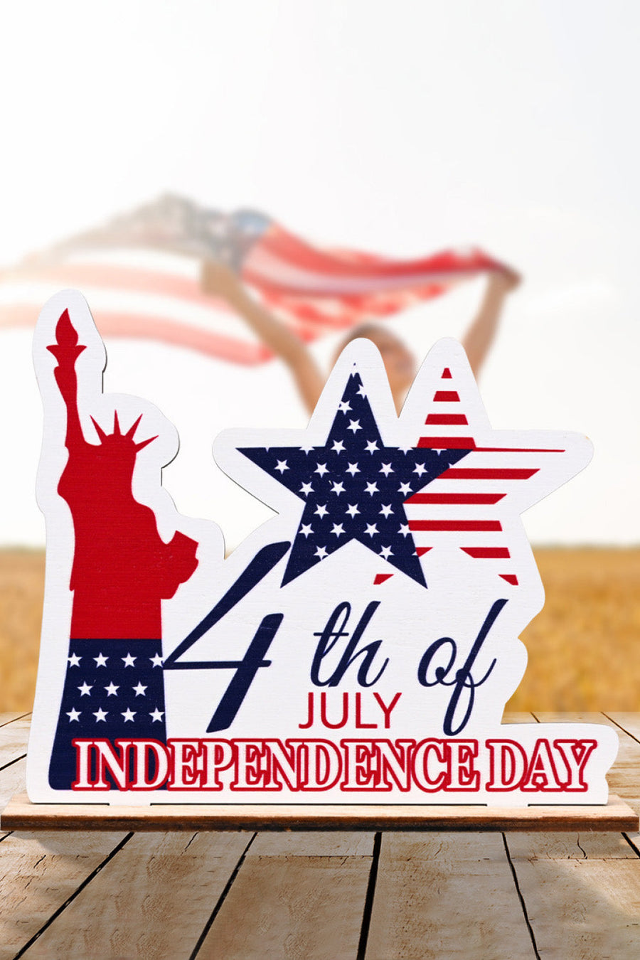 Patriotic Americana wooden tabletop decor with Statue of Liberty and stars and stripes.