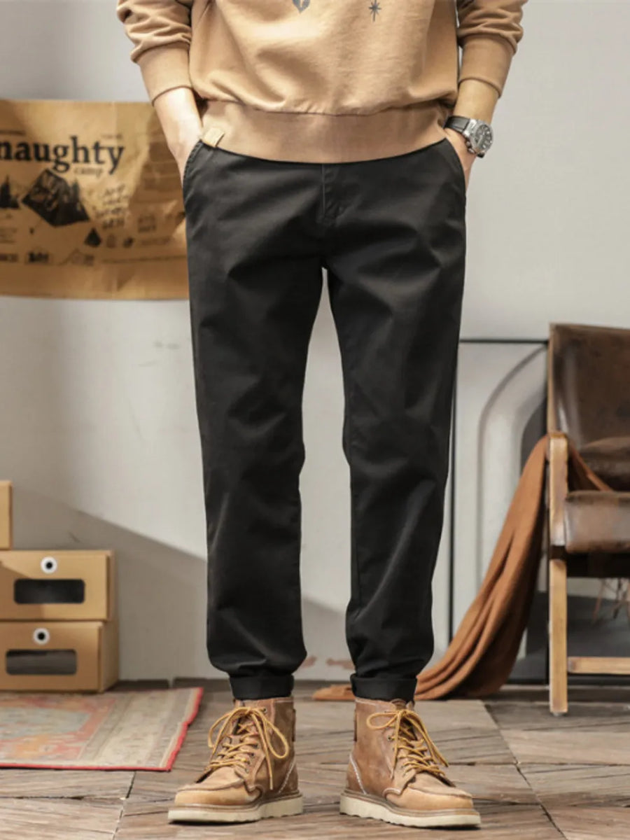 Men's black slim fit ankle pants with elastic cuffs and pockets