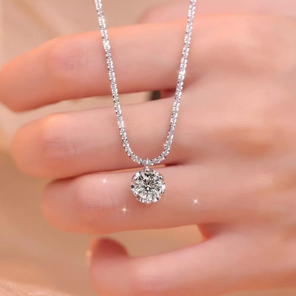 925 sterling silver,Moissanite Carat weight: 1ct Care instructions: Avoid wearin necklace in clear with delicate silhouette