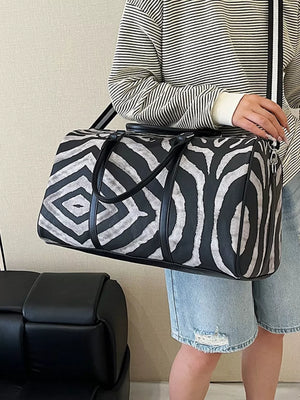 Bold zebra print large duffle bag with carry handles and detachable strap