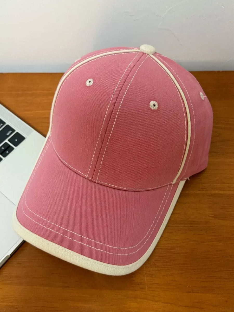 Dusty Rose cotton baseball cap with contrast stitching and cream trim