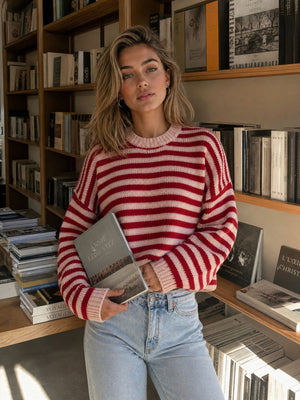 light pink crewneck sweater featuring stretchy and striped
