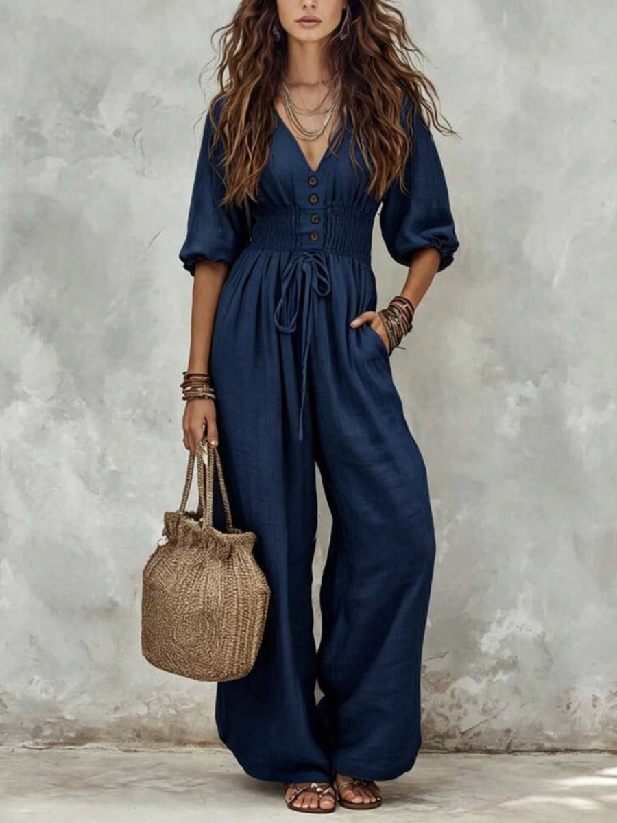 jumpsuit in navy blue featuring drawstring and wide-leg fit