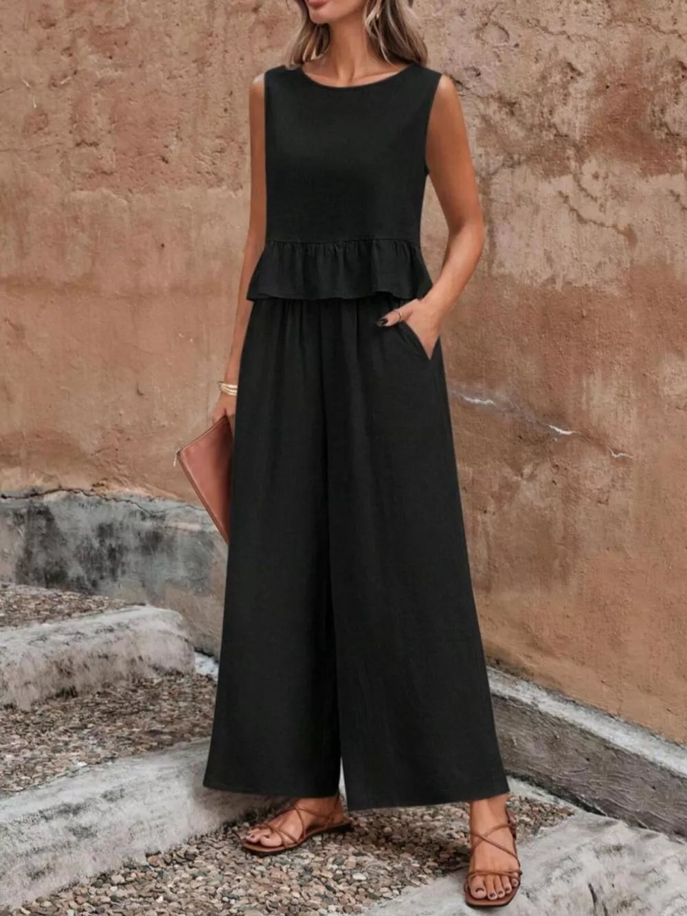 Black ruffled peplum top and wide-leg pants set with pockets