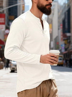 White long sleeve Henley t-shirt with button placket and ribbed texture.