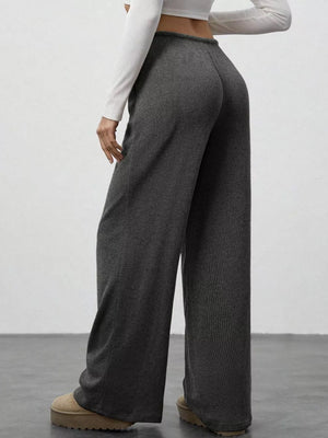 Dark gray ribbed wide-leg pants with drawstring detail