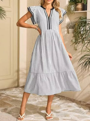 Striped midi dress with ruffled sleeves, V-neck, and tiered hem.