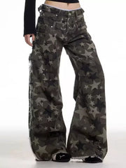 Star-embellished distressed wide-leg jeans in dark wash denim with raw hem detail.