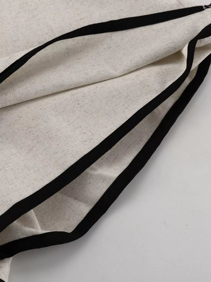 Cream linen blend top with black trim detail