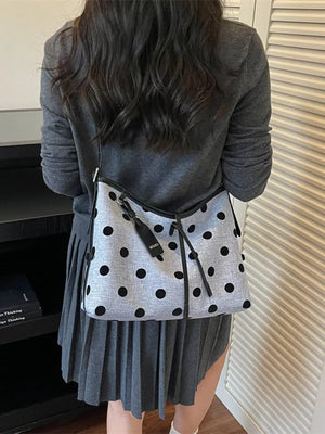 light blue handbag with tie and polka dot