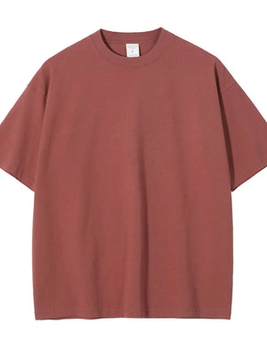 Oversized crewneck tee in rust, relaxed fit, short sleeves, basic casual style.