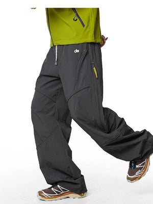 Graphite gray relaxed fit cargo active pants with drawstring and zippered pockets.