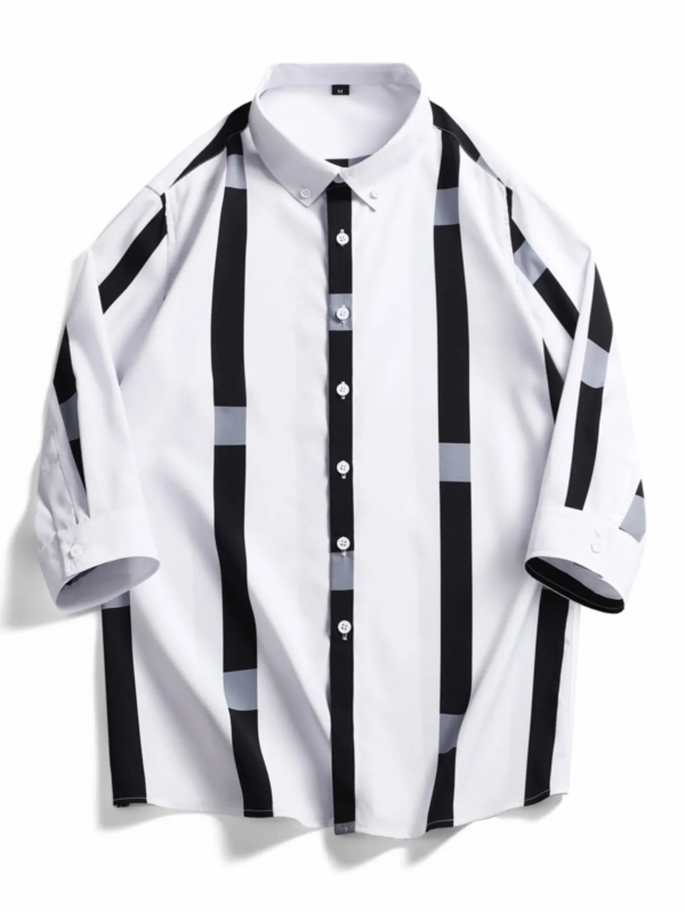 Oversized button-up shirt in white with black and grey vertical stripes and accents.