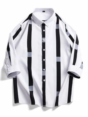 Oversized button-up shirt in white with black and grey vertical stripes and accents.