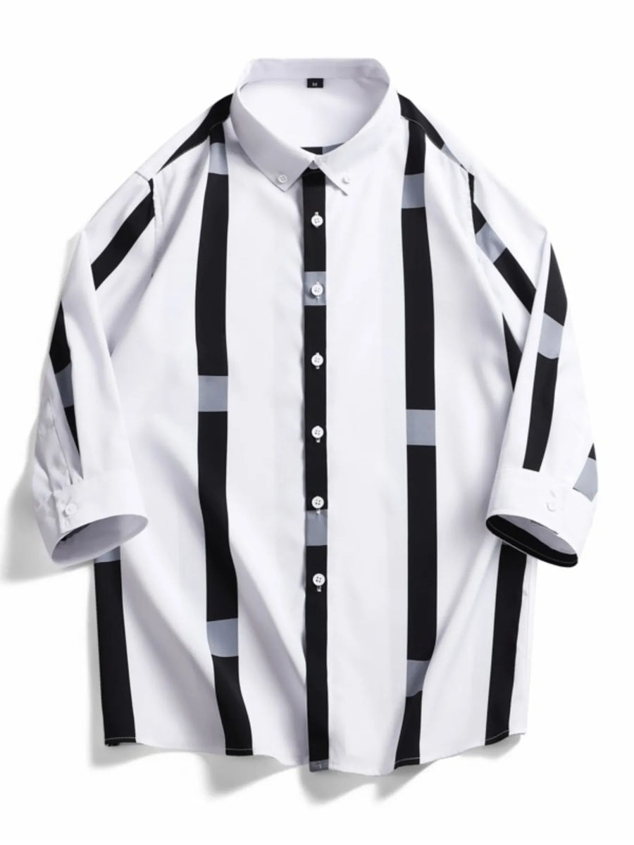 Oversized button-up shirt in white with black and grey vertical stripes and accents.