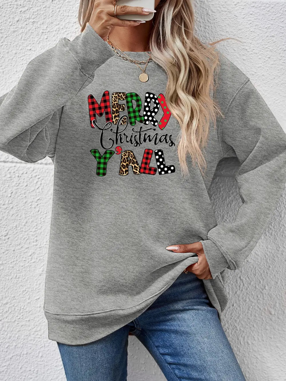 Grey graphic sweatshirt with Merry Christmas Yall text in mixed prints and plaid.