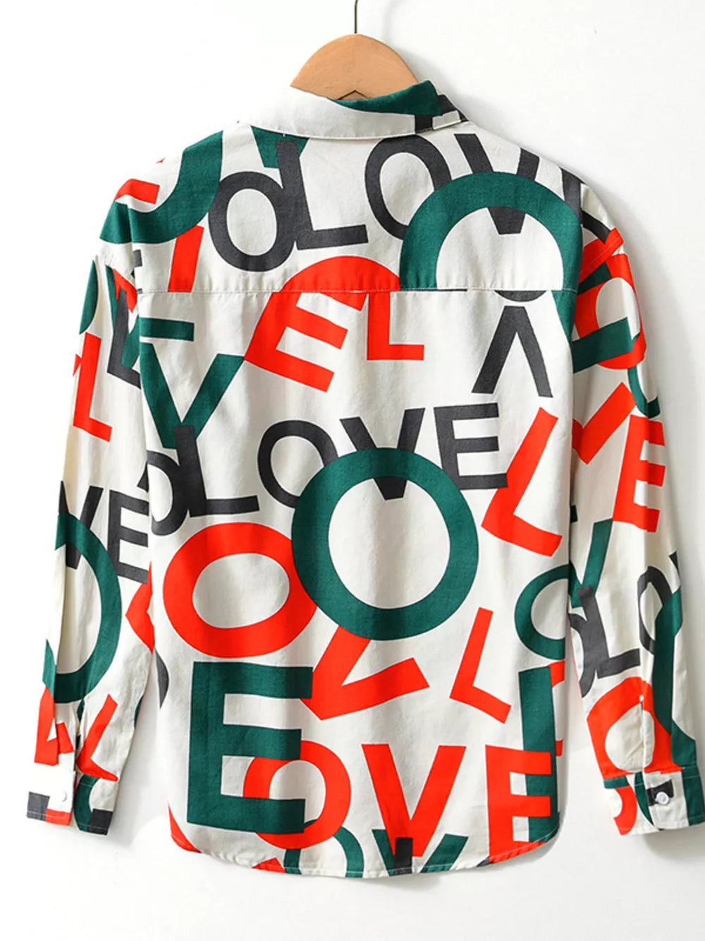 Men's long john shirt with all-over red, green, and black LOVE letter print on white cotton.