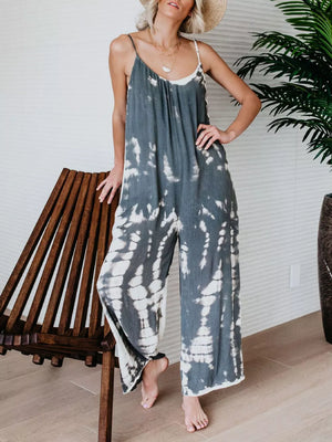 Jumpsuit with tie dye pattern, spaghetti straps, wide leg, and relaxed fit.