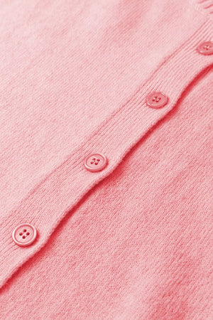 Pink acrylic knit cardigan with button front detail