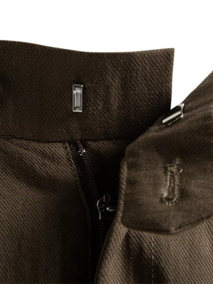 Classic pleated chino shorts in coffee with zipper and button closure detail.