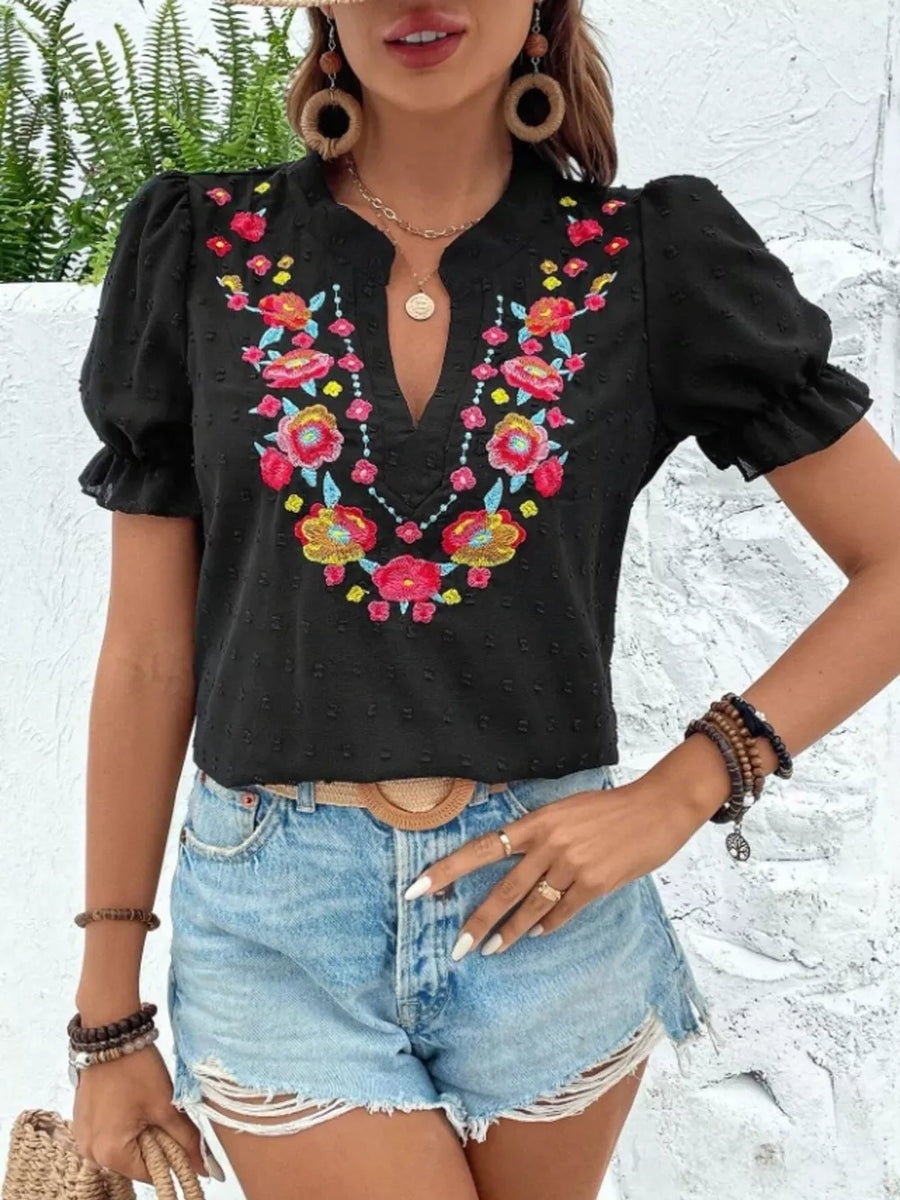 Black embroidered puff sleeve blouse with floral detail and v-neck