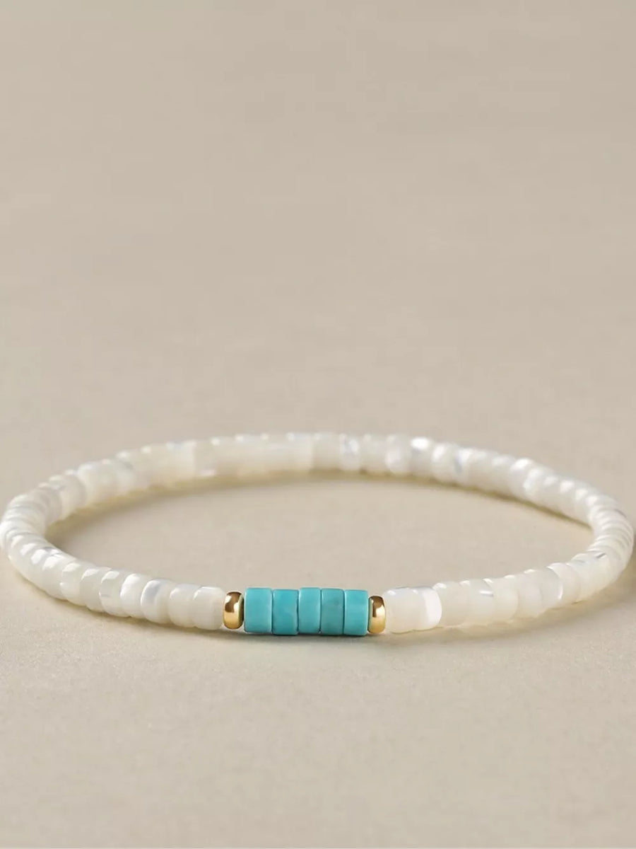 Turquoise,White mother-of-pearl Care instructions: 1 bracelet in white with beaded silhouette