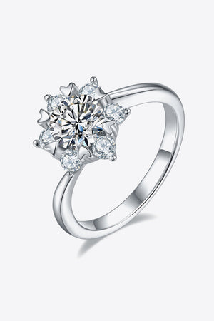 Silver floral cluster diamond ring made of 925 sterling silver with a central round cut diamond.
