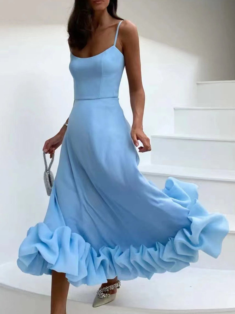 Light blue midi dress with spaghetti straps and a dramatic ruffle hem.
