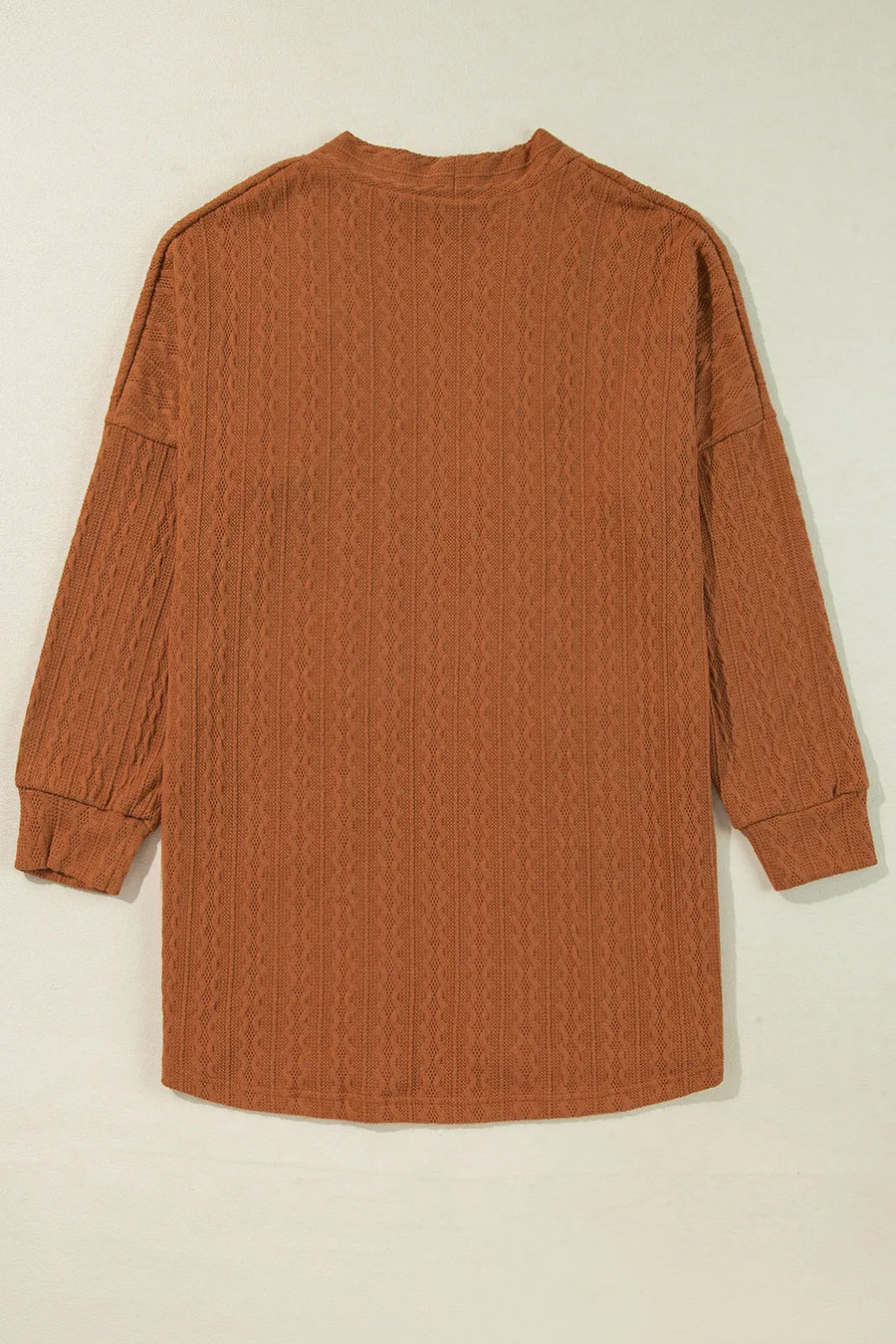 Terracotta open front cardigan with textured diamond pattern and long sleeves.
