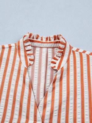 Striped V-neck mini dress with ruffled collar and textured fabric.