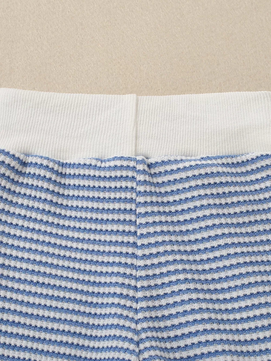 Baby knit set with blue and white stripes and a white ribbed waistband.