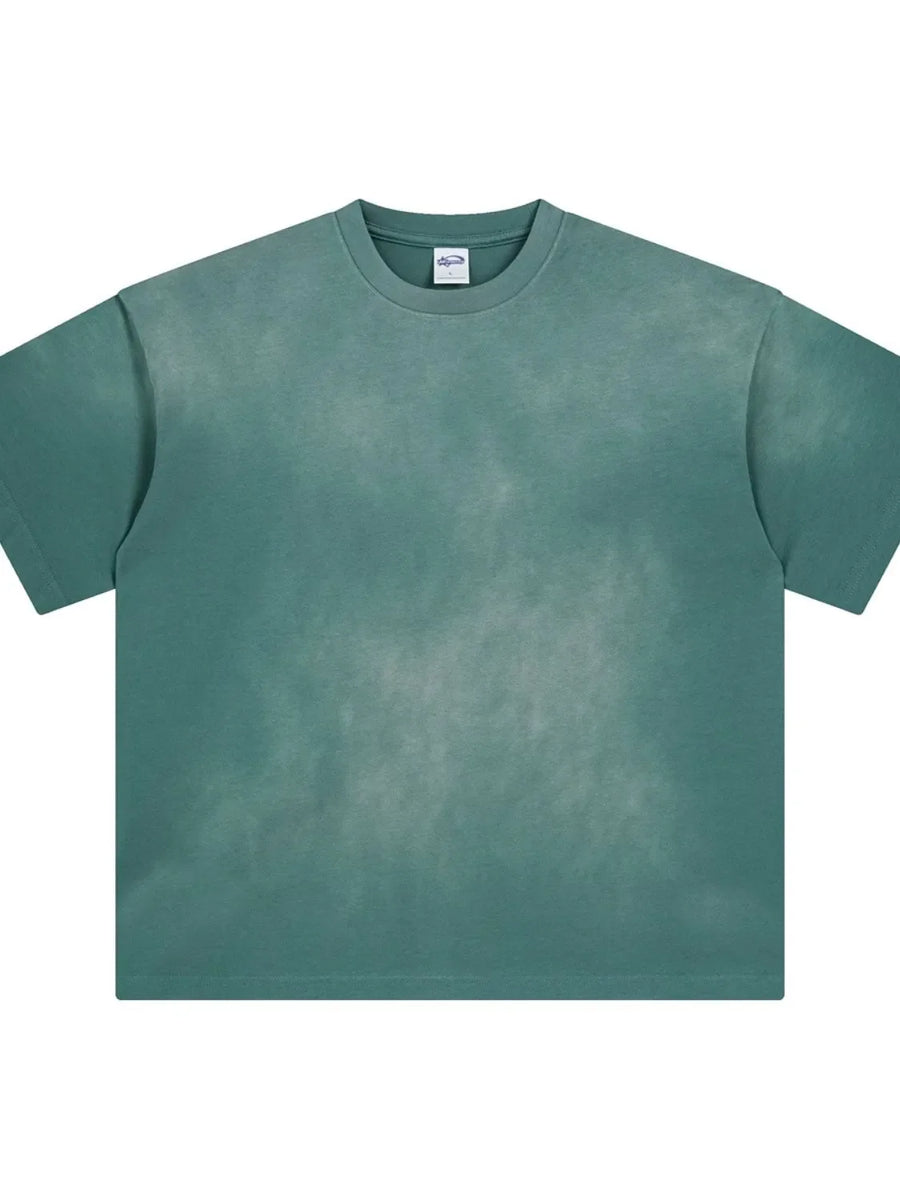 Oversized washed tee in deep teal with a relaxed fit and crew neck.