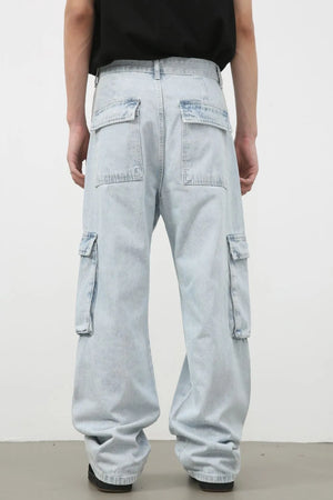 Oversized light wash denim cargo pants with multiple pockets and a relaxed fit.