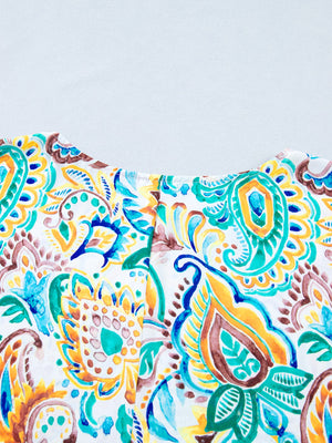 Paisley floral puff sleeve blouse with a scoop neck and watercolor print.