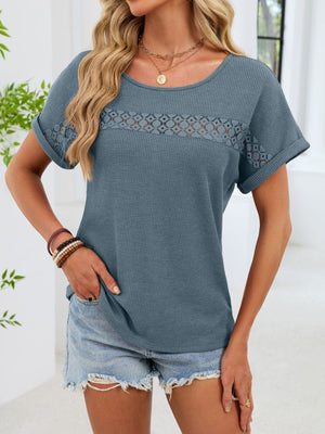 Blue waffle knit short sleeve tee with lace trim detail across the chest and sleeves.