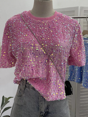 Pink iridescent sequin embellished t-shirt with crew neck and short sleeves.