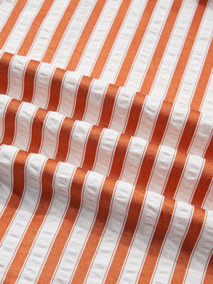Striped V-neck mini dress in orange and white seersucker fabric