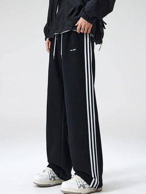 Men's black sweatpants with white side stripes and drawstring waist