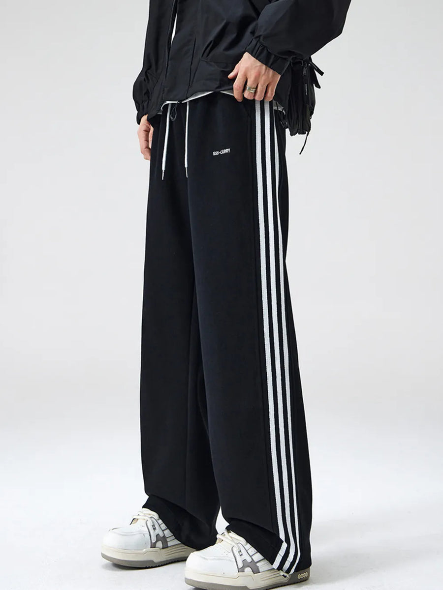 Men's black sweatpants with white side stripes and drawstring waist