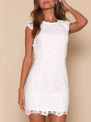 White lace mini dress with cap sleeves and scalloped hem detail.