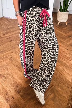 Leopard print maternity pants with drawstring and pink side stripe detail.