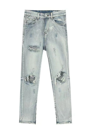 Light wash denim jeans with ripped knees and a slim fit.