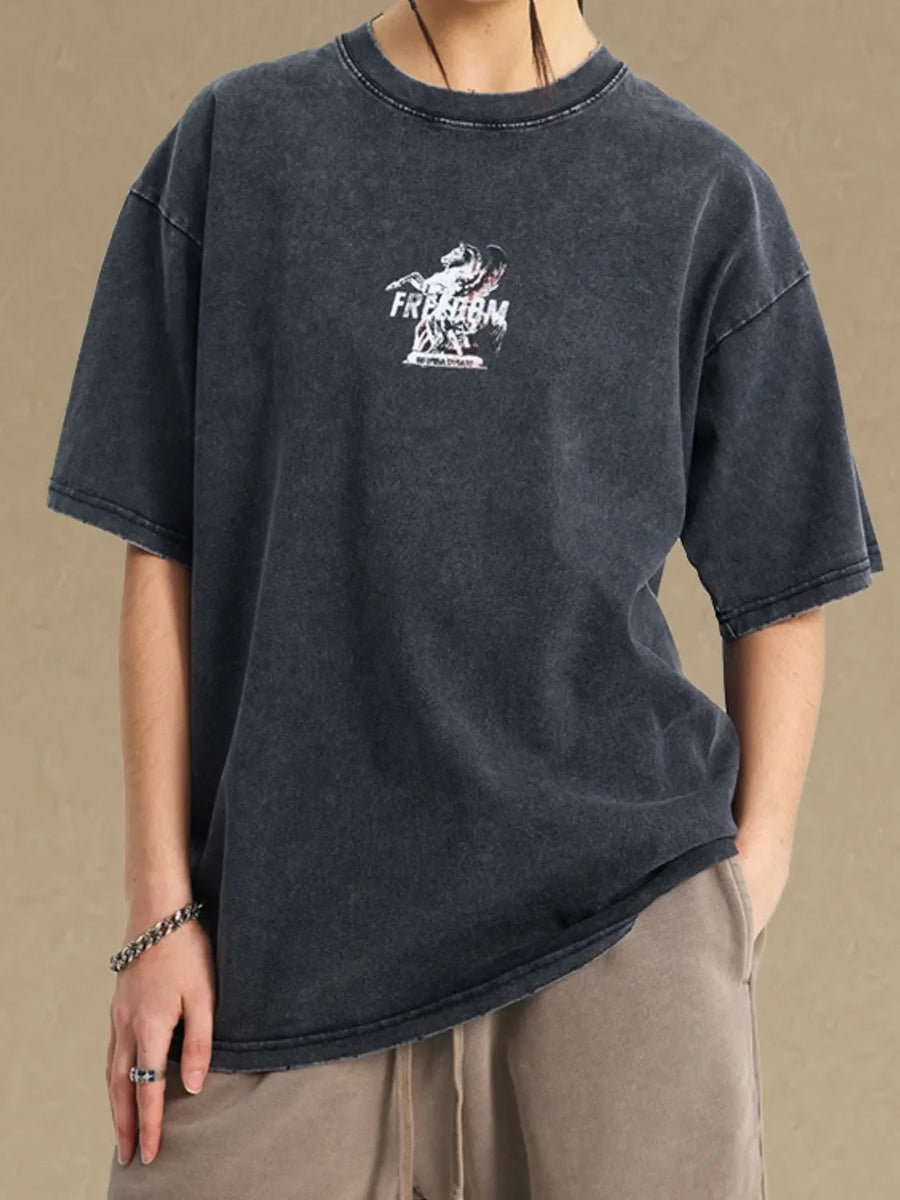 Black vintage wash graphic tee with a distressed "Freedom" horse print.