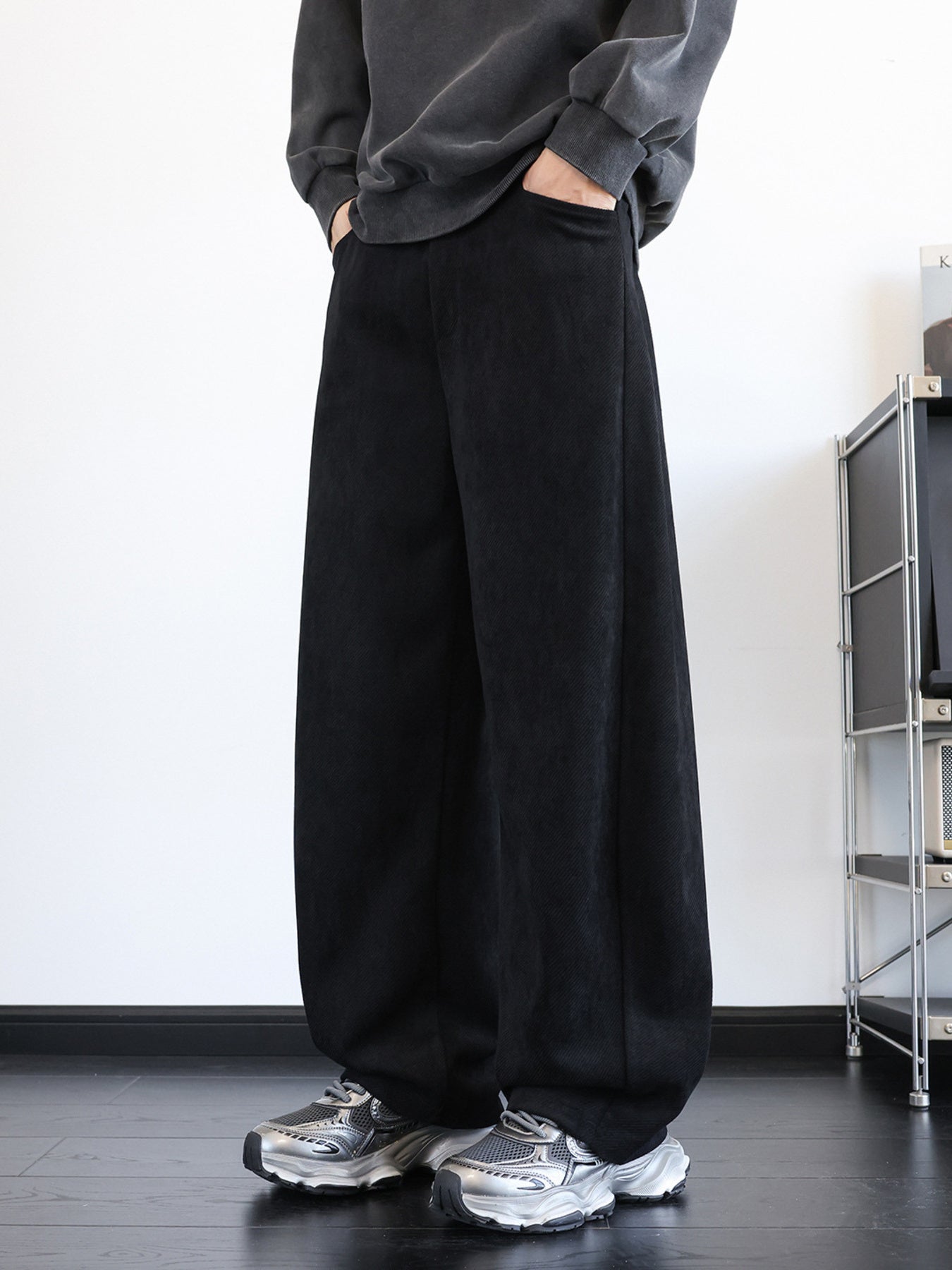 Men's black vintage washed wide leg sweatpants with pockets.